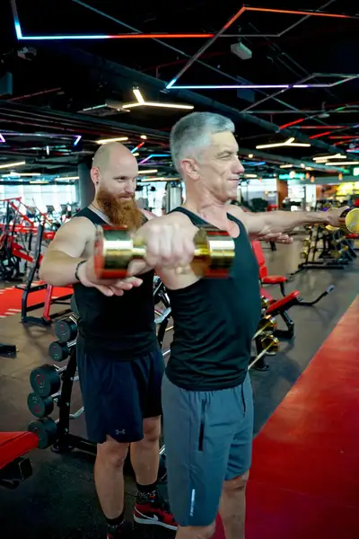 Dumbbell front raises, side by side
