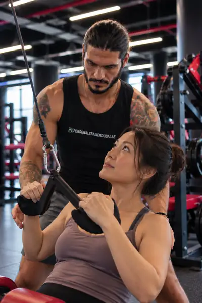 Petar coaching a cable row, form checked up close